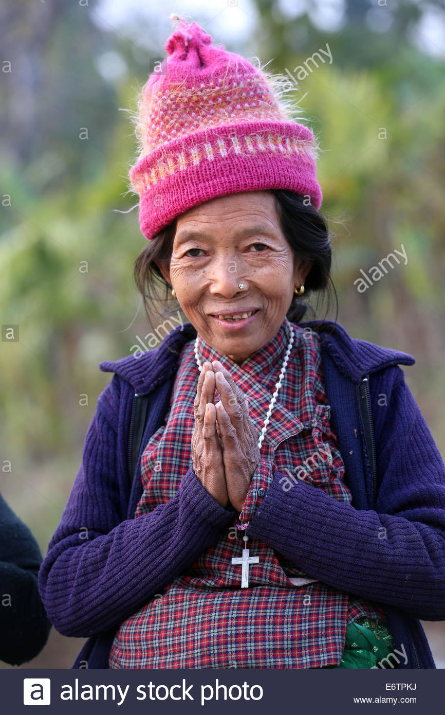 Portrait of a nepalese catholic christian woman greeting with 